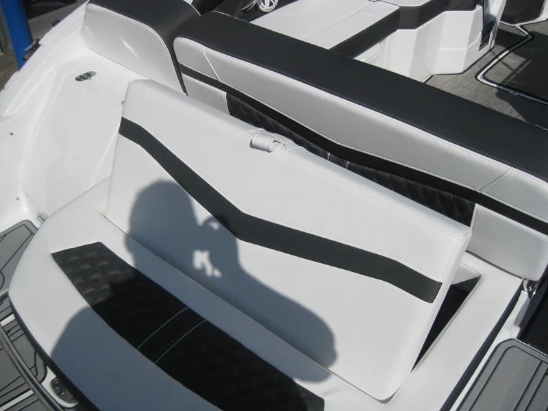 Slide: The Image of Interior of 2024 Monterey 258SS Super Sport boat, white and black upholstery. - 9