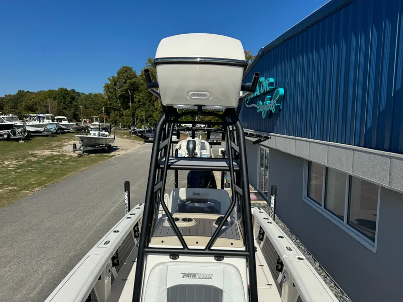 Slide: The Image of 2024 Pathfinder 2400 Open boat displayed at a dealership. - 13