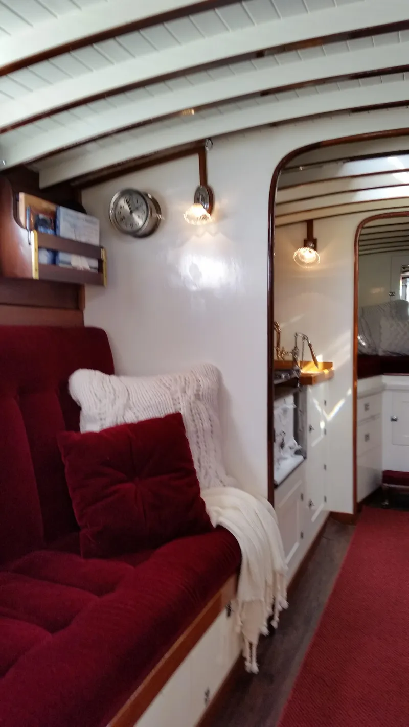 Slide: The Image of Interior of a 1930 Blanchard Lake Union Dreamboat with plush red seating and vintage decor. - 17