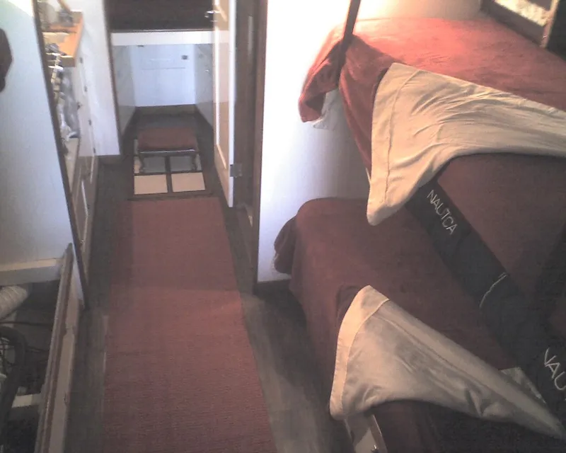 Slide: The Image of Interior of 1930 Blanchard Lake Union Dreamboat with bunk beds and narrow hallway. - 18