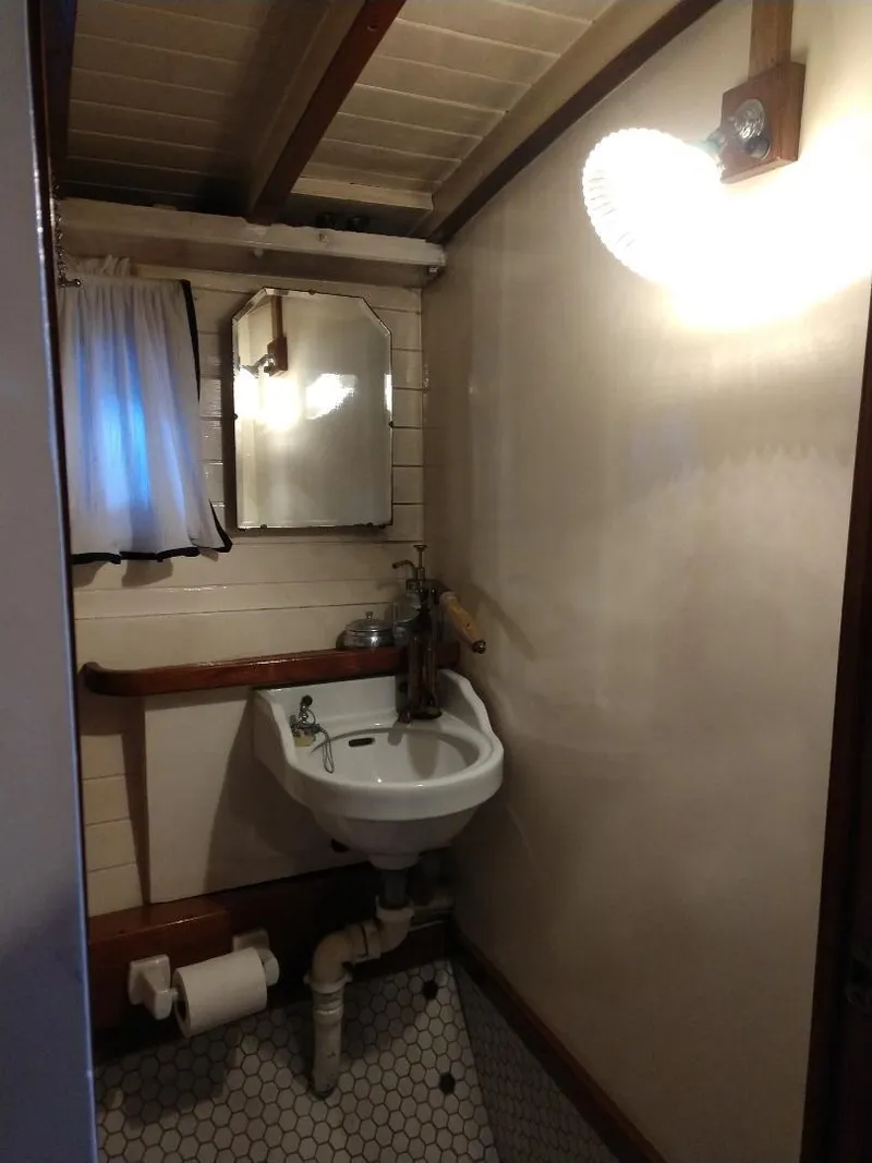 Slide: The Image of 1930 Blanchard Lake Union Dreamboat bathroom with vintage sink and mirror. - 20
