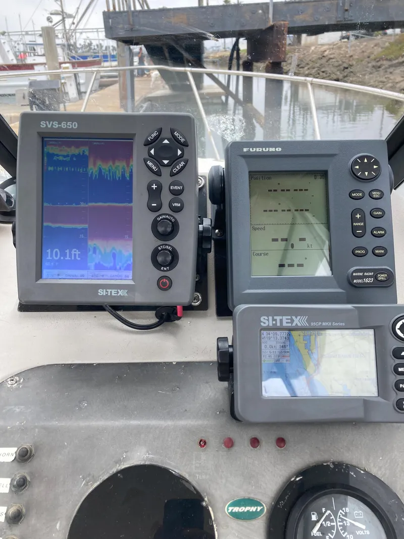 Slide: The Image of 2003 Trophy 2052 Walkaround boat with navigation and fish-finding equipment. - 10