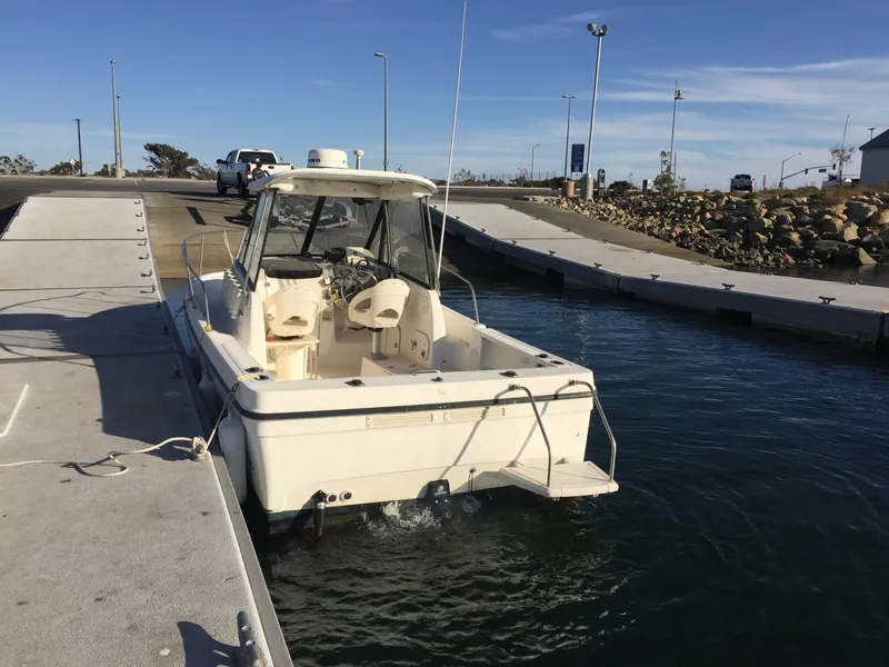 Slide: The Image of 2003 Trophy 2052 Walkaround boat docked at a marina. - 5