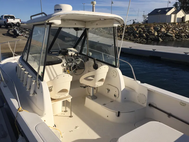 Slide: The Image of 2003 Trophy 2052 Walkaround boat docked at a marina. - 6