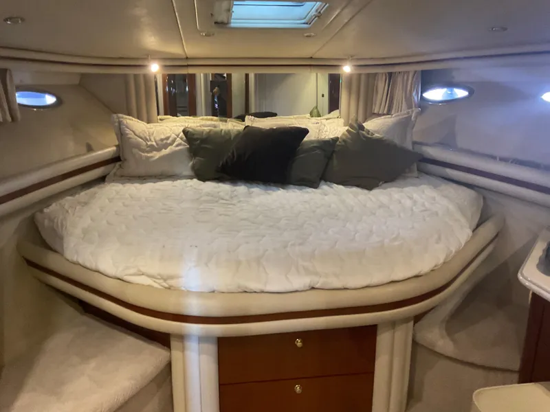 Slide: The Image of Luxurious bedroom interior of 1999 Sea Ray 560 Sedan Bridge yacht. - 12