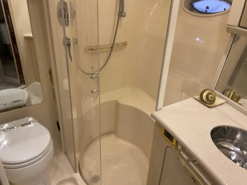 Slide: The Image of Bathroom interior of 1999 Sea Ray 560 Sedan Bridge yacht with shower and sink. - 18