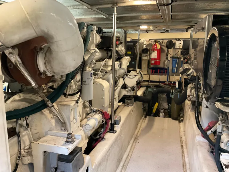 Slide: The Image of Engine room of a 1999 Sea Ray 560 Sedan Bridge yacht, showcasing machinery and equipment. - 23