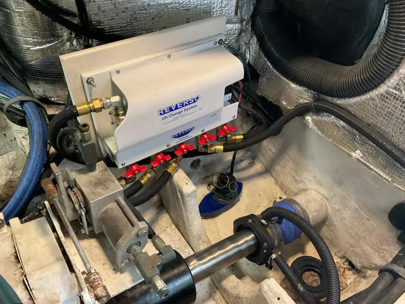 Slide: The Image of Engine room of 1999 Sea Ray 560 Sedan Bridge with Reverso oil change system. - 26