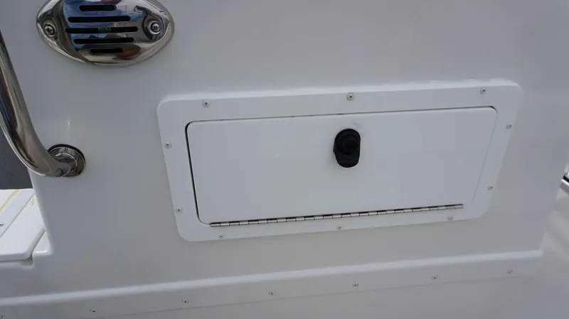 Slide: The Image of Storage compartment on a 2024 Parker 1801 CS boat. - 7