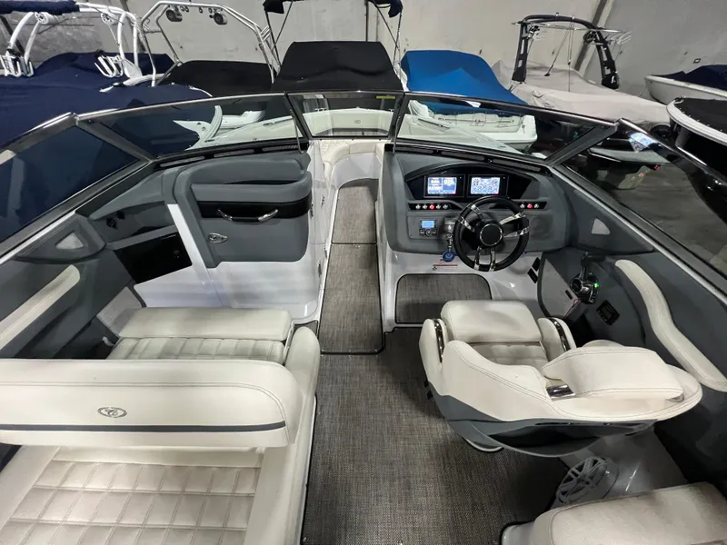 Slide: The Image of 2018 Cobalt R5 boat interior with modern dashboard and luxurious seating. - 11