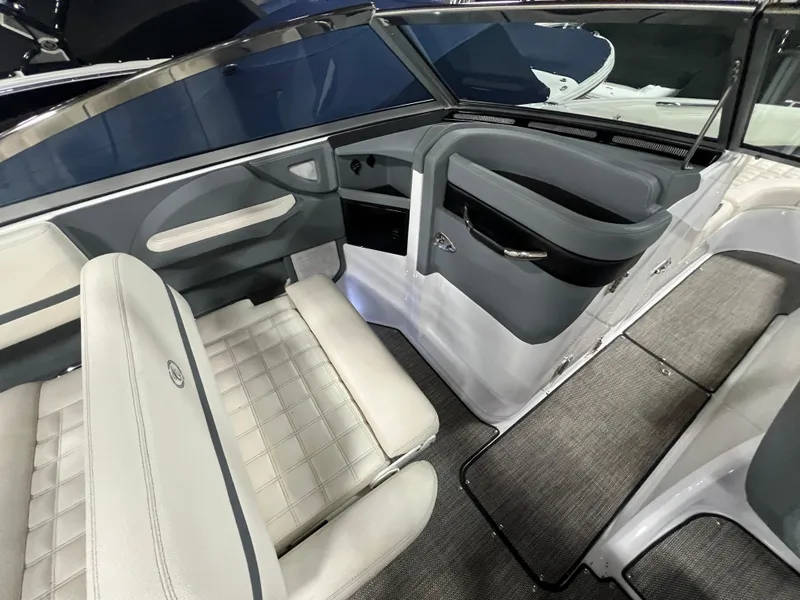 Slide: The Image of Interior of a 2018 Cobalt R5 boat with gray and white seating. - 12