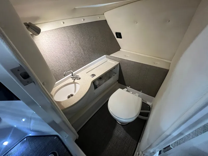 Slide: The Image of 2018 Cobalt R5 boat interior bathroom with sink and toilet. - 13