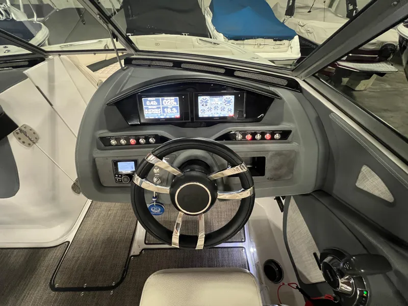 Slide: The Image of 2018 Cobalt R5 boat dashboard with steering wheel and digital displays. - 15