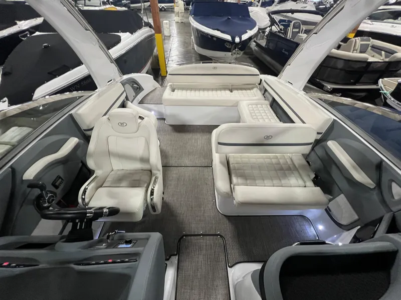 Slide: The Image of 2018 Cobalt R5 boat interior with white seating and modern design. - 16