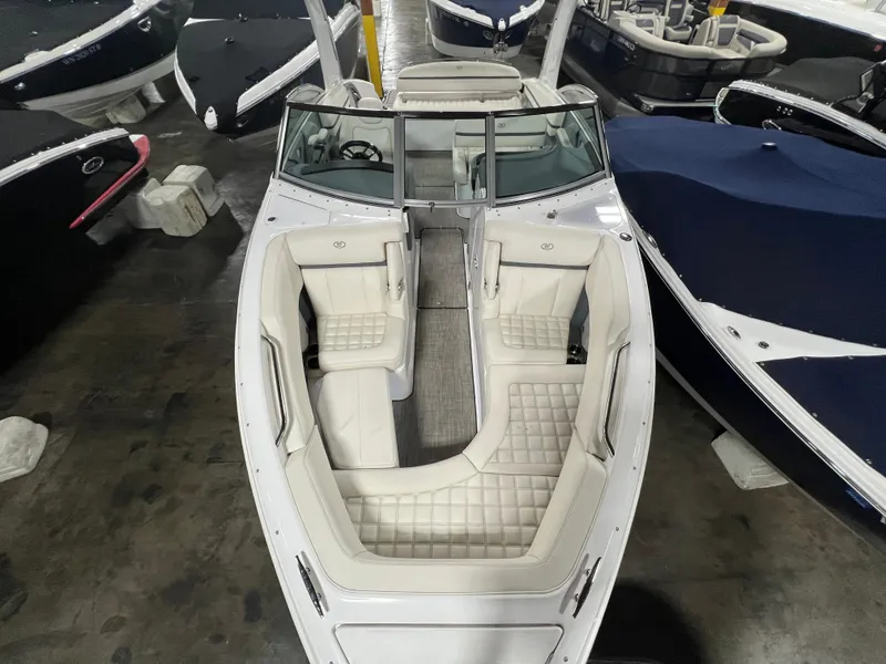 Slide: The Image of 2018 Cobalt R5 boat with white interior, docked indoors. - 18