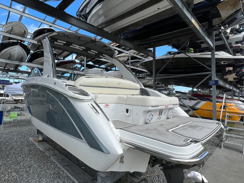 Slide: The Image of 2018 Cobalt R5 boat in storage, showcasing sleek design and spacious seating. - 21