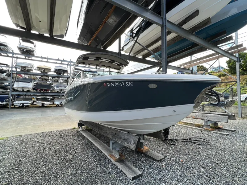 Slide: The Image of 2018 Cobalt R5 boat in storage, surrounded by other boats on racks. - 25