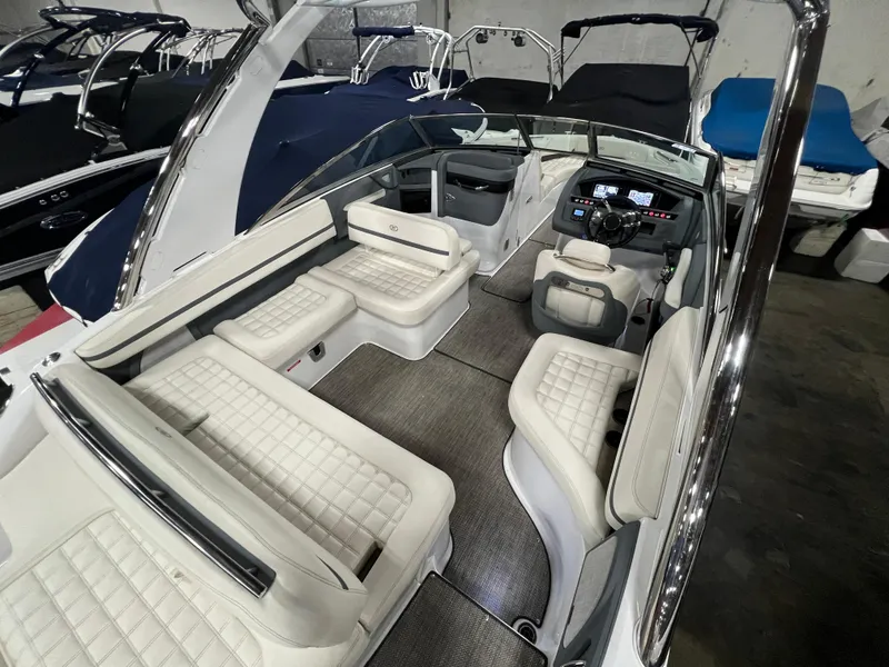 Slide: The Image of 2018 Cobalt R5 boat interior with white seating and modern dashboard. - 7