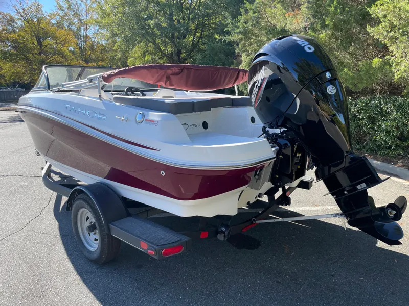 Slide: The Image of 2024 Tahoe 185 S boat with outboard motor on trailer. - 2