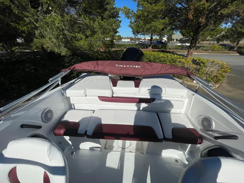 Slide: The Image of 2024 Tahoe 185 S boat interior with maroon and white seating. - 4