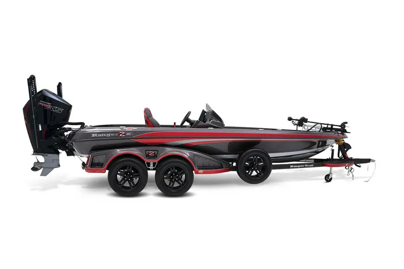 Slide: The Image of 2024 Ranger Z521R boat on trailer, parked outdoors, featuring sleek red design. - 2