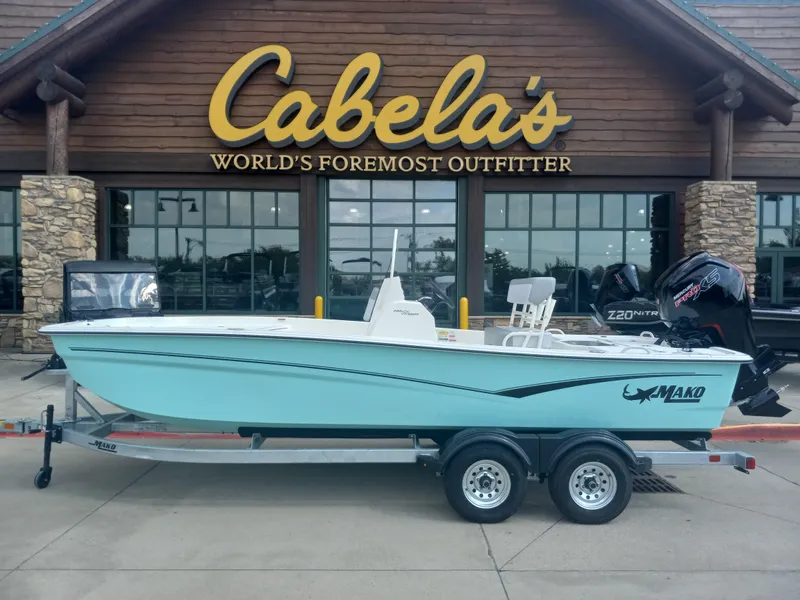 The Image of 2024 Mako Pro Skiff 19 CC boat on trailer outside Cabela's store. - 0