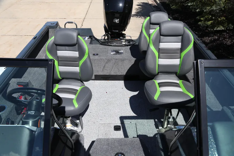 Slide: The Image of 2024 Ranger VS1682SC Angler boat interior with four cushioned seats and steering console. - 2