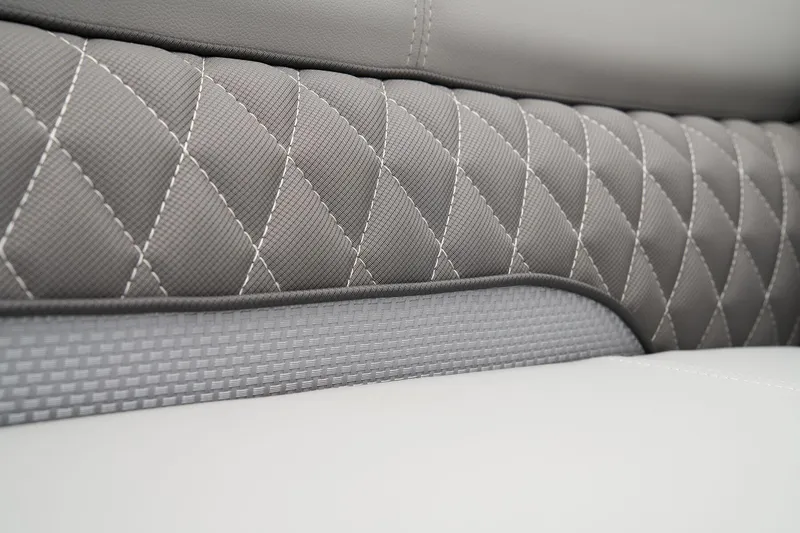 Slide: The Image of 2024 Ranger Reata 223F interior with diamond-stitched gray upholstery. - 48