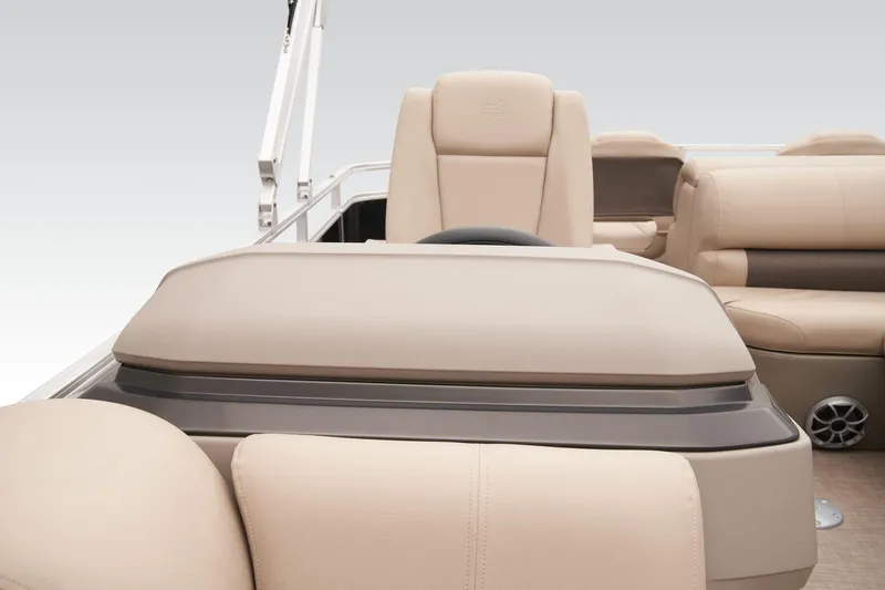 Slide: The Image of 2024 Sun Tracker SportFish 22 DLX interior with beige seating and helm station. - 30