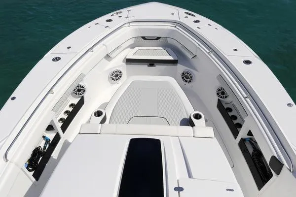 Slide: The Image of 2024 Blackfin 400 CC boat interior with storage compartments and coiled hose. - 22
