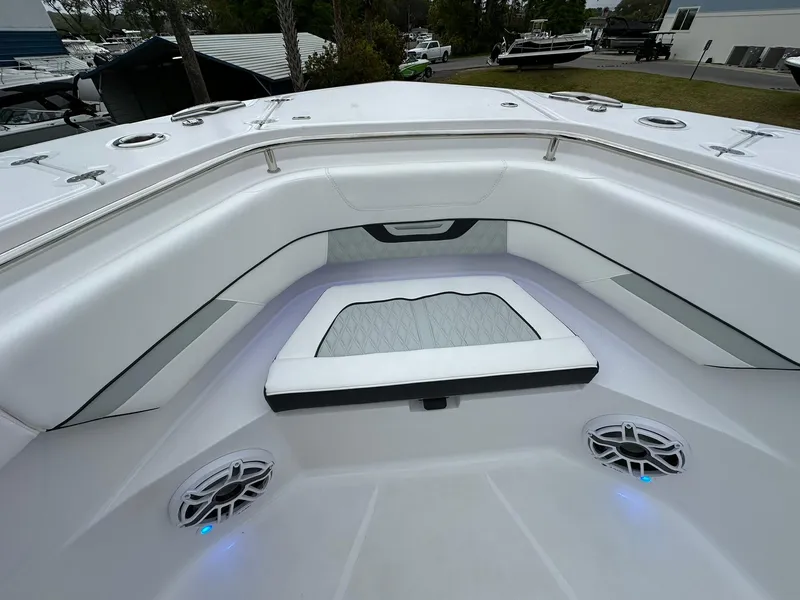 Slide: The Image of 2024 Blackfin 400 CC boat interior with open storage compartment and cup holders. - 23