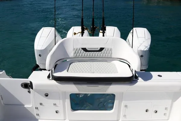 Slide: The Image of 2024 Blackfin 400 CC boat deck with rod holders and sleek design. - 32