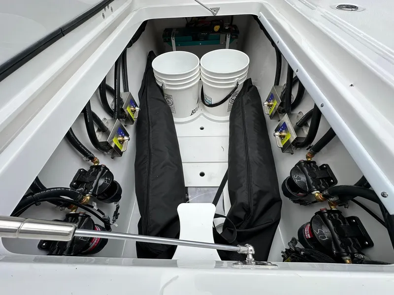 Slide: The Image of 2024 Blackfin 400 CC boat interior with fishing station and storage compartments. - 41