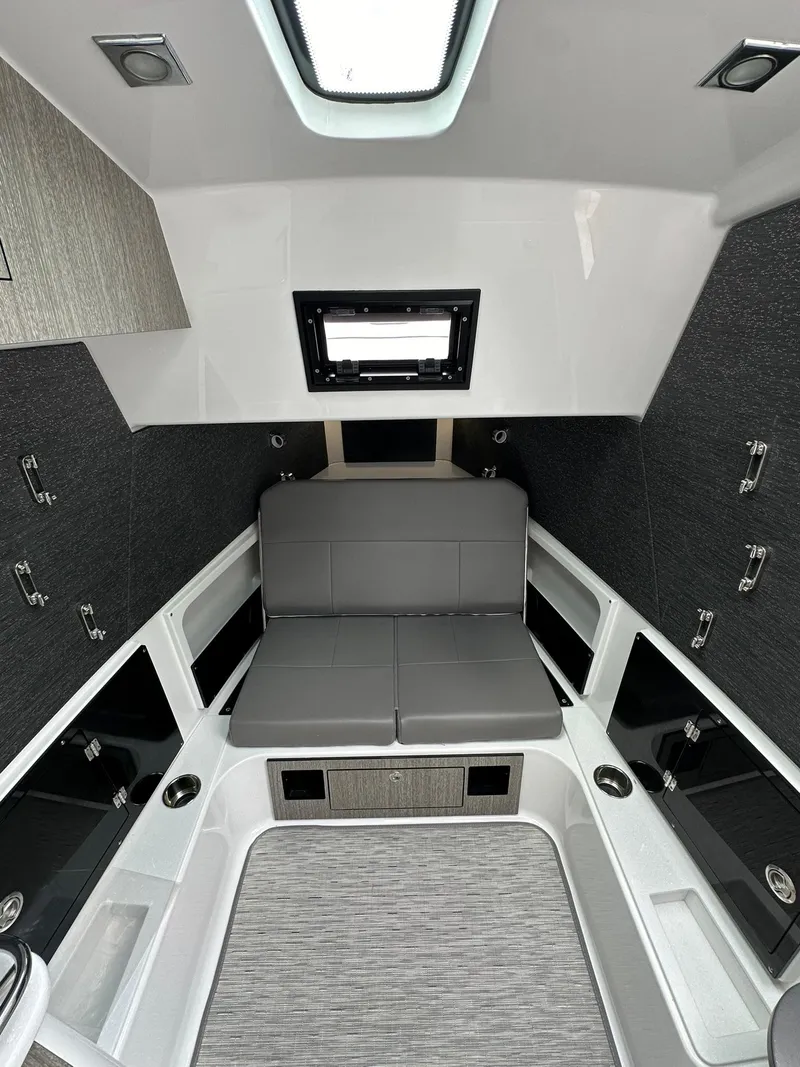 Slide: The Image of 2024 Blackfin 400 CC boat interior with modern seating and storage compartments. - 46
