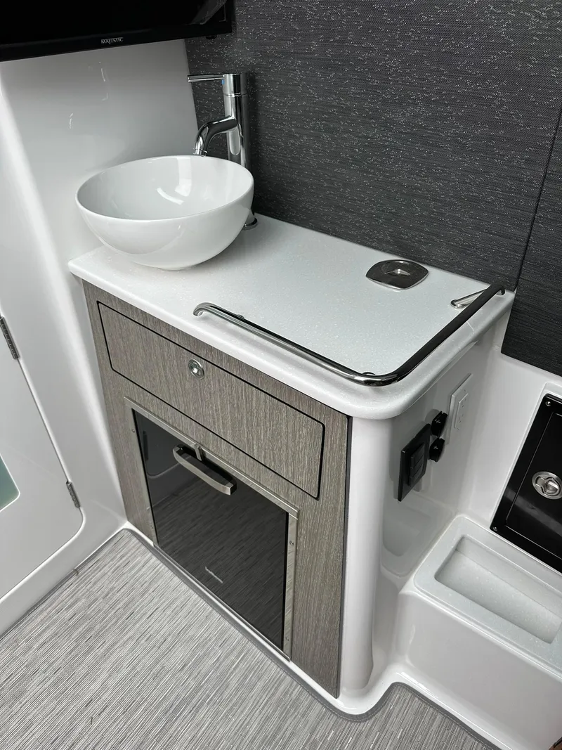 Slide: The Image of 2024 Blackfin 400 CC cabin interior with gray cushioned seating. - 51