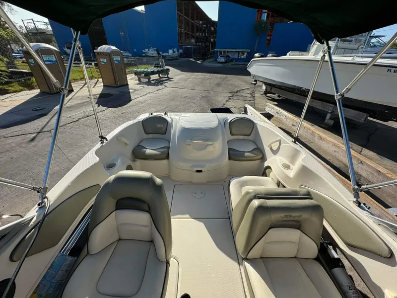 Slide: The Image of Interior of a 2005 Sea Ray 180 Sport boat at a marina. - 12