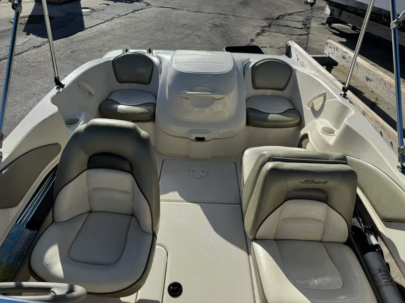Slide: The Image of Interior of a 2005 Sea Ray 180 Sport boat with seating and storage compartments. - 14
