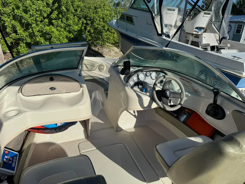 Slide: The Image of Interior of a 2005 Sea Ray 180 Sport boat with steering wheel and dashboard. - 18