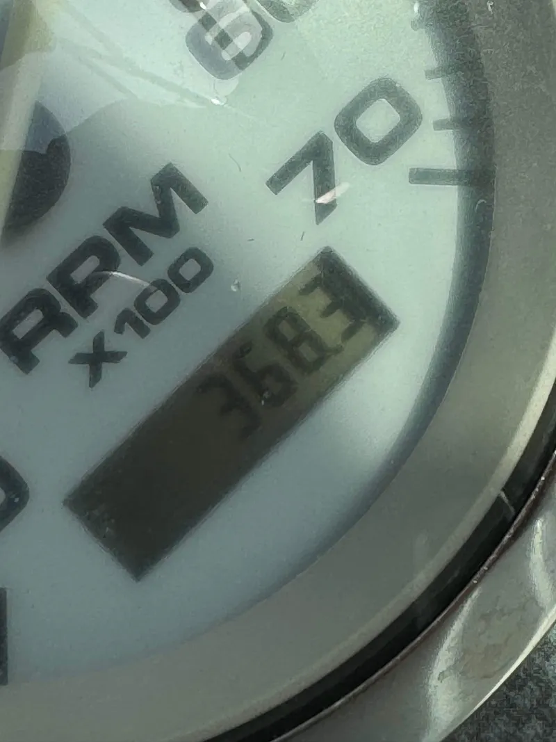 Slide: The Image of Close-up of 2005 Sea Ray 180 Sport tachometer showing 368.3 hours. - 19