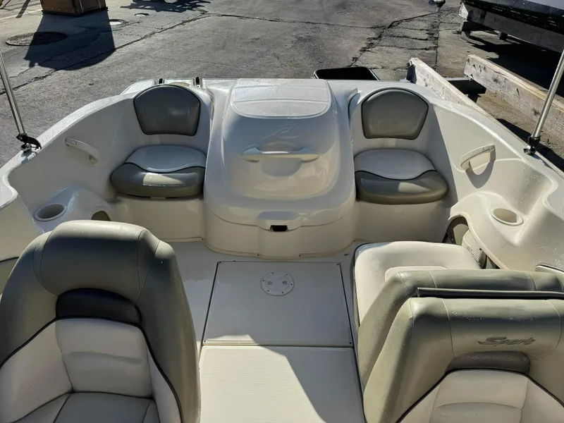 Slide: The Image of Interior of a 2005 Sea Ray 180 Sport boat with cushioned seating. - 20