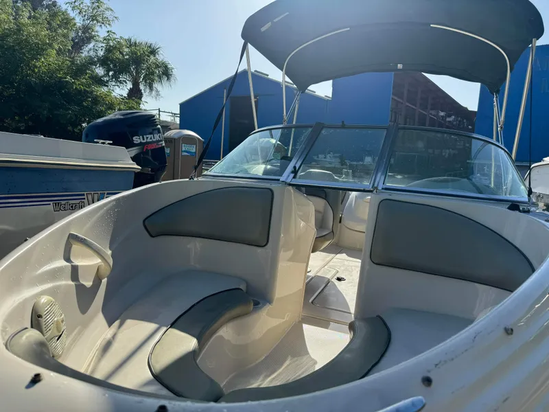 Slide: The Image of 2005 Sea Ray 180 Sport boat with Suzuki outboard motor in marina. - 25