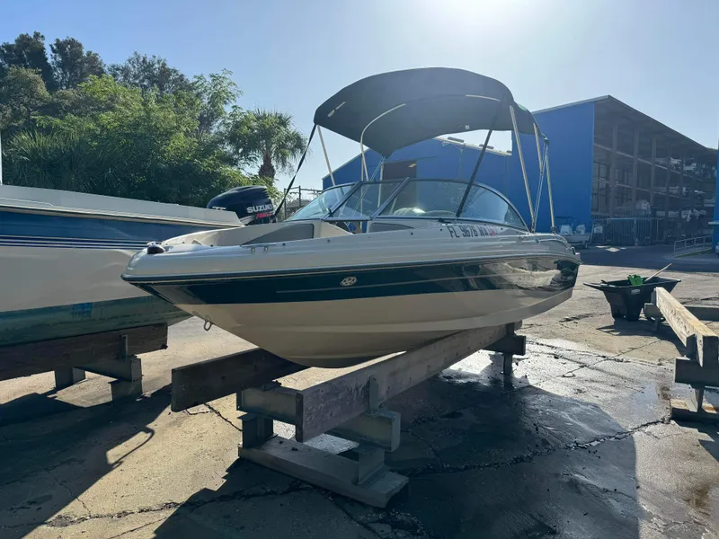 Slide: The Image of 2005 Sea Ray 180 Sport boat on dry dock with Suzuki outboard motor. - 27