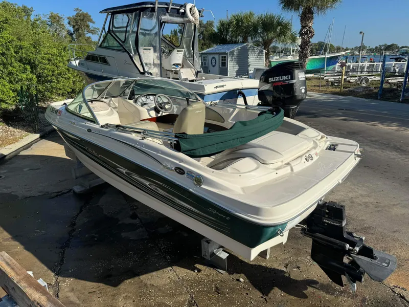 Slide: The Image of 2005 Sea Ray 180 Sport boat with Suzuki outboard motor at marina. - 29