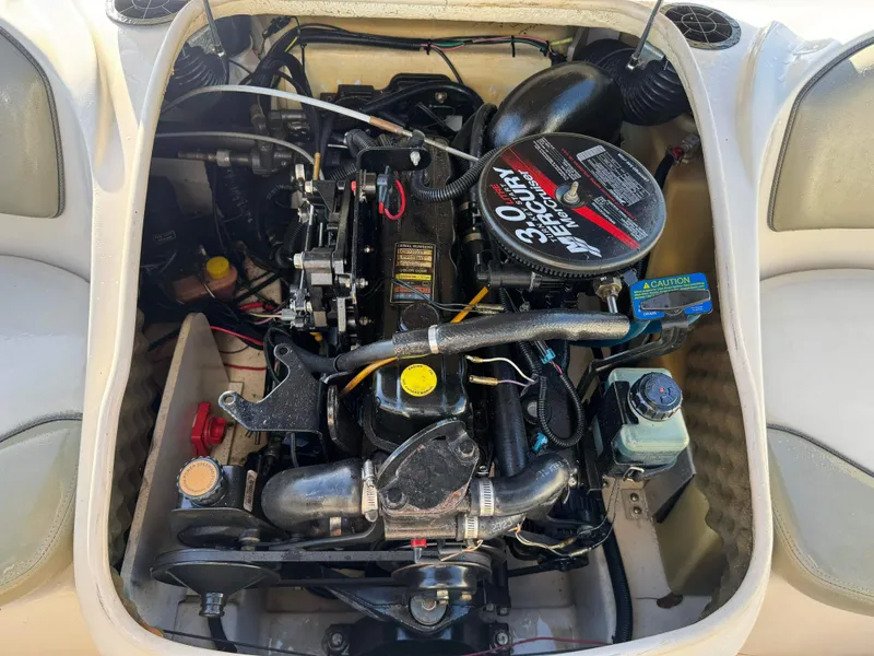 Slide: The Image of Sea Ray 180 Sport 2005 boat engine compartment with 3.0L MerCruiser engine. - 35