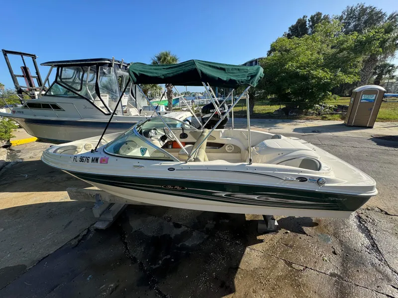 Slide: The Image of 2005 Sea Ray 180 Sport boat docked at a marina. - 6