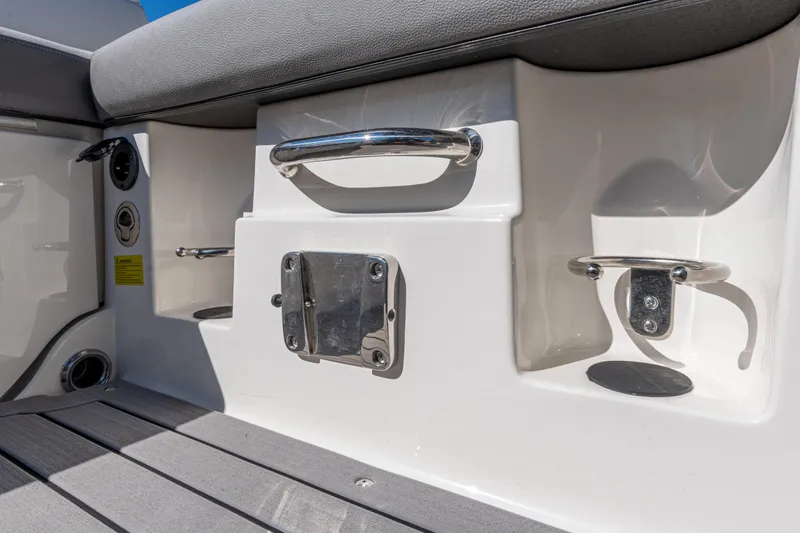 Slide: The Image of 2021 Sea Ray SDX 250 boat interior with stainless steel fixtures and seating. - 16