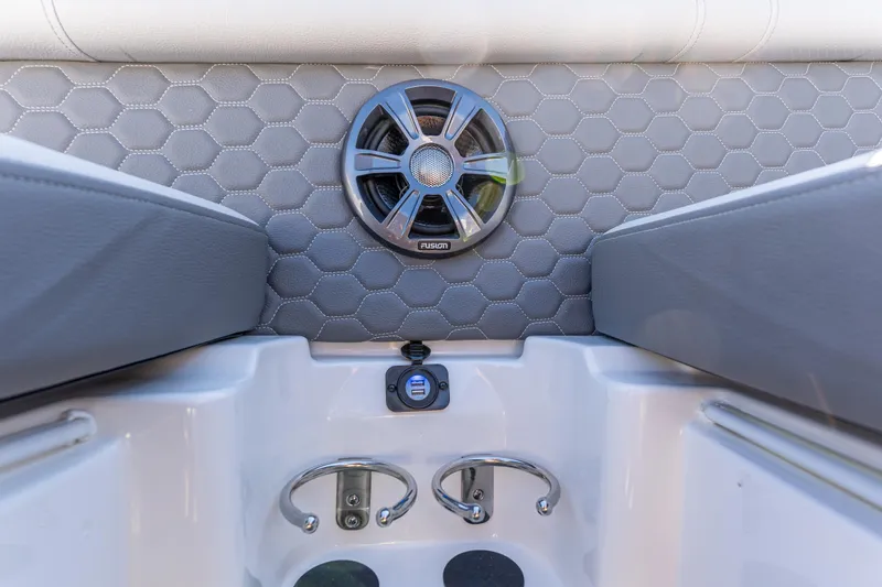 Slide: The Image of 2021 Sea Ray SDX 250 boat interior with speaker and cup holders. - 26