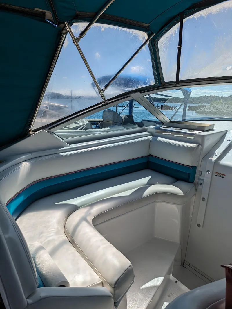 Slide: The Image of Interior of 1993 Chaparral 280 SIGNATURE boat with white and teal seating. - 10