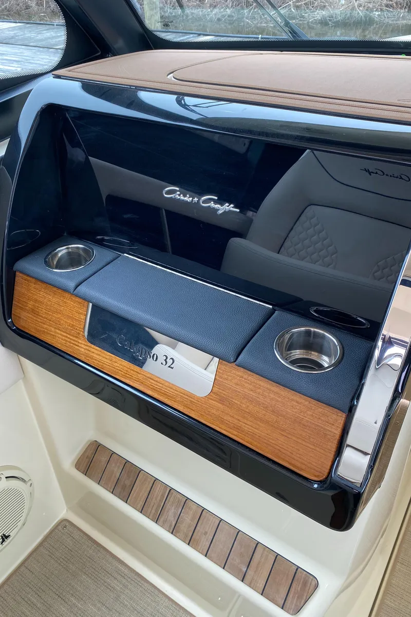 Slide: The Image of 2024 Chris-Craft Calypso 32 dashboard with Mercury and Garmin controls. - 15