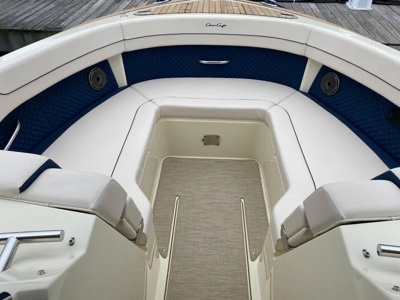 Slide: The Image of 2024 Chris-Craft Calypso 32 boat docked, showcasing its sleek design and spacious interior. - 19